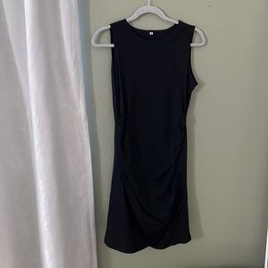 Tight side cinched black dress.